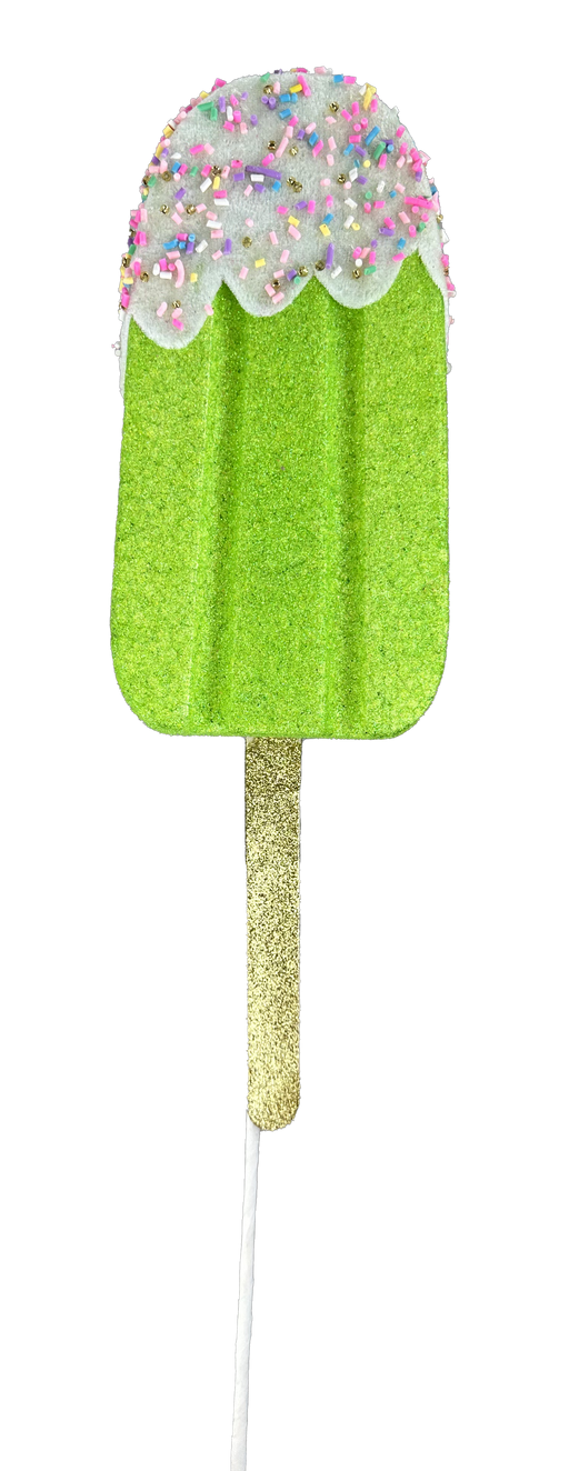 A whimsical Glittery, green popsicle ornament named "21-inch-by-4-inch-by-1.5-inch Green Sprinkle Popsicle Spray 86105GN," features a sparkly stick and is finished with white frosting adorned with colorful sprinkles, perfect for adding charm to any decor on a black background.