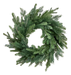 The DIA24x54Tips Green Belgium Pine Wreath 86375WR24 features dense, needle-like pine branches in a classic circular design, creating a fresh festive look against any plain white background.