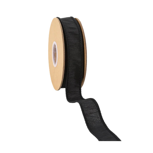 A spool of 1 Black Dupioni Wired Ribbon (9100W-030-25E), with 10 yards partially unrolled, hangs down slightly curled from the cardboard spool featuring a central circular cutout, set against a clean white background.