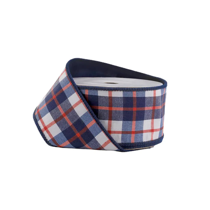 The Red White and Blue Plaid Dupioni Ribbon (2.5" x 10 yds, 9115W-036-63E) features a blue, red, and white plaid pattern with dark blue stitched edges, perfect for festive decor or crafting. Displayed against a plain white background.