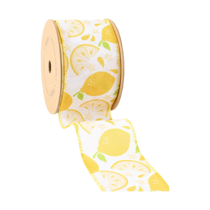 The 2.5 Inch Lemon Slice on White Ribbon (9318W-640-63E) features yellow lemon and slice patterns with green leaves on white, a light yellow edge, and is partially unrolled—perfect for wreaths.