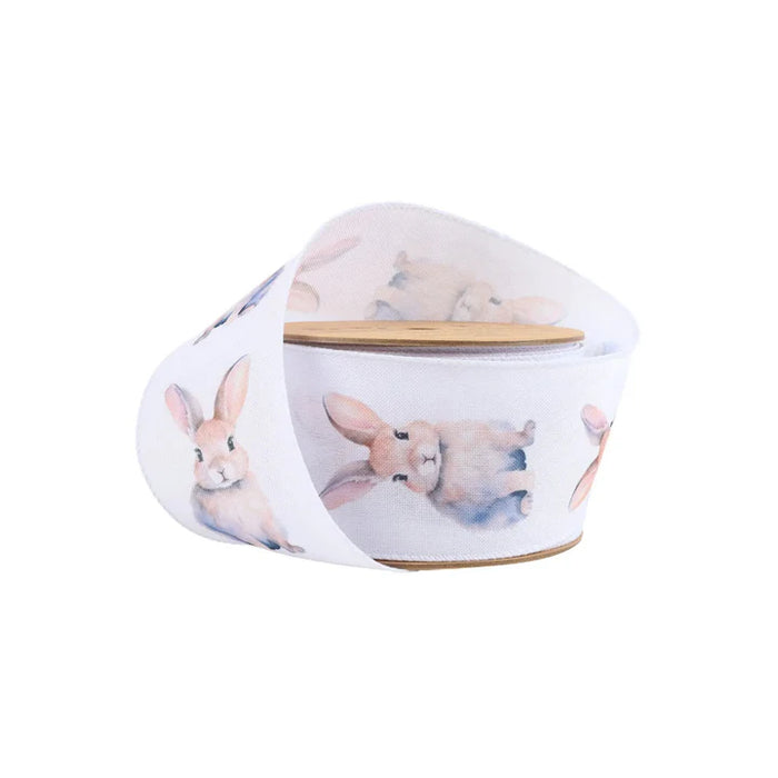 The 2.5 Inch Printed Bunny on White Ribbon 9325W-029-63E features light brown and white watercolor-style bunny illustrations, ideal for wreaths or gift wrapping, and is displayed against a plain white background.