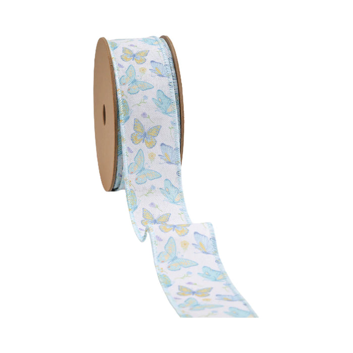 A spool of 1.5 White and Blue Butterflies Ribbon (9331W-029-38E) features a pastel butterfly pattern in blue and yellow hues on a light background and is partially unrolled, revealing its delicate design with brown circular ends.