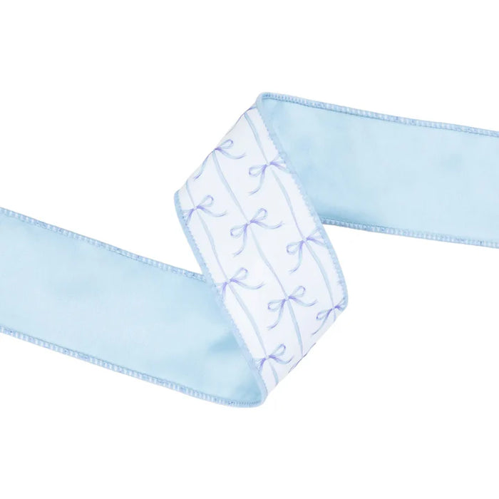 The 2.5 Inch Blue Bows on White Dupioni with Blue Backing Ribbon (9362W-311-63E) features a white dupioni center panel with small purple bows and blue stitching along the light blue sash edges.