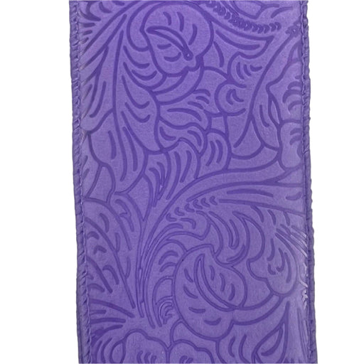 The 2.5X10Y Lavender Flower Embossed Ribbon 984240-30 features a floral embossed pattern with swirling leaves and abstract paisley shapes in rich purple, offering an elegant texture ideal for any decorative project.