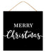 The 10Sq Merry Christmas Sign Black/White AP7244 is made of MDF and paper, features Merry Christmas in two fonts on a black rectangular background, and hangs from a string.