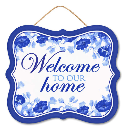 The 10.5Lx9H MDF Welcome to Our Home sign features a scalloped royal blue border with floral accents and elegant script. It is designed with blue flowers and hangs gracefully from a thin rope for a stylish, welcoming look.