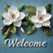 The 10 x 10 Welcome Magnolia Sign (Blue) TTE-070 features white magnolia flowers and green leaves above Welcome on a blue rustic wooden background, adding charm to your home decor.