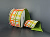 The 2.5x10Y Moss Double Sided: Fall Tuttola Plaid/Moss Dupioni Ribbon D61530-40-08 features an orange, yellow, and green plaid front with a solid moss green back, displayed on a dark gray background with one end unrolled flat.