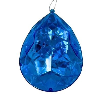 The 6.3" x 4" x 9" Dark Blue Plastic Drop Ornament (DCORN5408DKBL) features a faceted teardrop design with a top loop for hanging and sparkling geometric surfaces that reflect light.