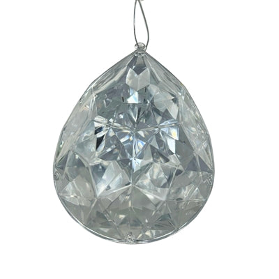 The 6.3" x 4" x 9" Silver Plastic Drop Ornament (model DCORN5408SL) features a faceted teardrop shape that sparkles as it reflects light, making it a dazzling addition to any décor.
