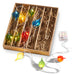 A 6-foot Lighted Multicolored Shiny Kismet Garland L4320902, featuring vibrant, teardrop-shaped string lights in red, blue, yellow, and green. It comes neatly arranged with shredded paper padding and includes a conveniently visible battery pack outside the box.