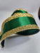 A close-up of the 2.5X10YD Emerald Gold Vertical Glitter Stripe Ribbon (LS31207R), featuring glittery gold edges, curled on a white surface.
