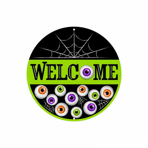 The 8Dia Metal Welcome W/Eyeballs Sign (Black/White/Orange, MD1369) features a round metal design with bold WELCOME letters and colorful cartoon eyeballs for a fun touch.