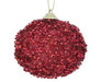 The 80MM Glitter Ball Ornament Red MTX69683 features a round shape with red sequins and beads, hanging from a thin gold string. Its textured surface provides a sparkling and festive appearance.