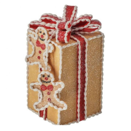 Decorative gingerbread-themed gift box with a red ribbon on a white background