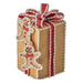Decorative gingerbread-themed gift box with a red ribbon on a white background