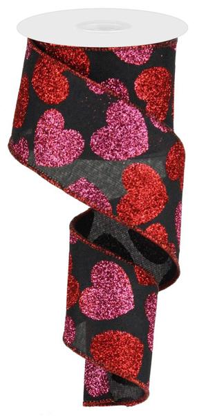 The 2.5 X10Yd Black/Red/Pink Bold Hearts On Royal Ribbon RG0166902 features glittery red and pink hearts of varying sizes on black ribbon, adding a festive sparkle thats perfect for special occasions.