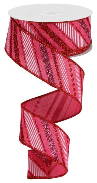A spool of 1.5 x 10yd ribbon (RGB130111) with hot pink, red, pink, and white multi diagonal stripes and glitter accents is shown unspooled in a loose spiral.
