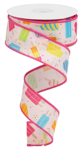 A 1.5-inch ribbon, Powder Pink Yellow Orange Turquoise Lime Popsicles On Royal (RGC132215), features colorful popsicle designs and bright pink edges, partially unrolled in a charming spiral shape.