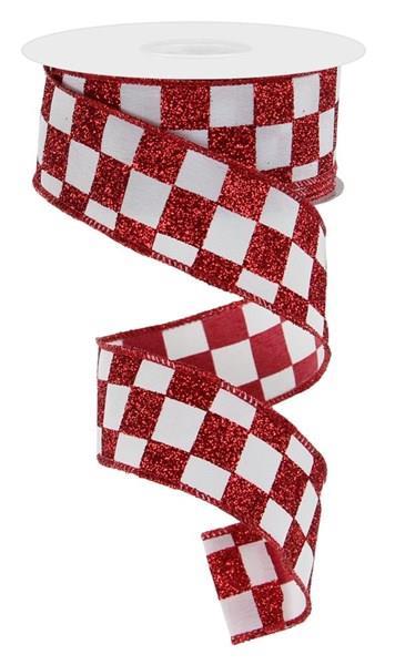 A spool of 1.5 x 10YD Red and White Check On Pg Fabric Ribbon (RGC1800W7) with a glittery checkerboard pattern, unspooled in a loose spiral.