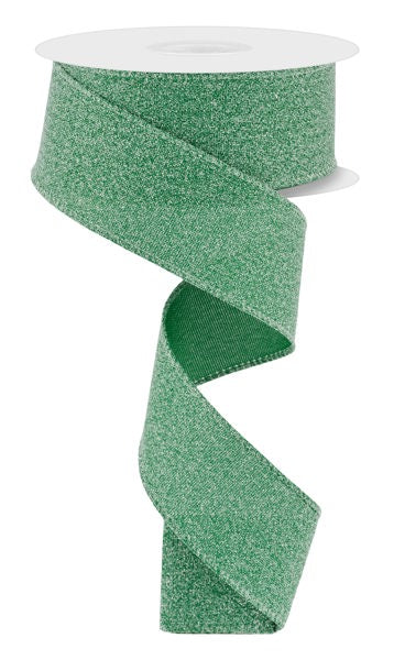 A 1.5 x 10 yd Emerald Green Crystal Shine Ribbon (RGE199406) unfurls in a loose spiral against a white background.