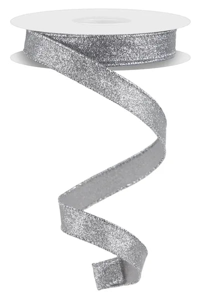 A 5/8 x 10YD Silver Shimmer Glitter Ribbon (RGF108926) hangs in a loose spiral against a white background, displaying its sparkling silver shine.