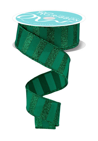 A 1.5 x 10 yd spool of emerald green ribbon (RGF196606) with horizontal glitter stripes and matte accents, partially unrolled and curling down; the spool’s white top features printed text.