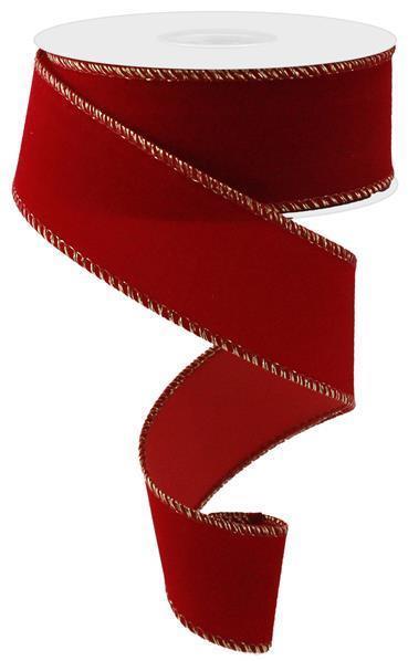 The 1.5 x 10YD Red Outdoor Velvet Ribbon RL1954PT with gold-stitched edges unravels in a spiral on a white background, offering an elegant touch ideal for outdoor displays.
