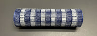 A 10X10Y Navy-Cream Small Chex Plaid Mesh XB235510-27 cylindrical object is on a dark gray surface.