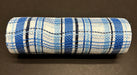 A 10x10Y roll of Navy-Lt Blue-White Fabric Plaid Mesh (XB240110-27) sits on a dark surface, displaying an intricate weave and mesh-like texture, with navy, light blue, and thin black lines.