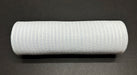 A roll of White Breeze Solid Mesh, 10"X10Y XB240710-01 rests on a dark surface, showcasing its solid mesh with a textured, grid-like pattern and appears tightly wound.