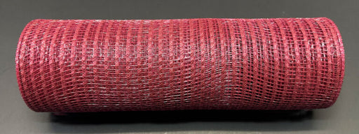 A neatly rolled, cylindrical 10X10Y Burgundy Breeze Solid Mesh XB240710-10 rests on a dark surface, featuring a textured appearance with evenly spaced openings throughout the fabric.