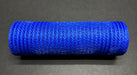 A tightly rolled 10"X10Y Royal Blue Breeze Solid Mesh Mesh XB240710-25 sits on a dark gray surface. The cylindrical mesh displays a textured, woven appearance.
