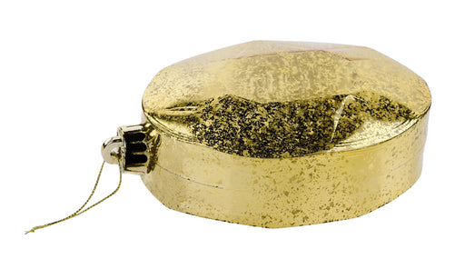 The 6.5 x 4.25 Gold Oval Faceted Gem Ornament XJ551708 features a glittery textured surface, metal cap, and hanging string. This octagonal gold ornament shines brilliantly and is shown against a white background.