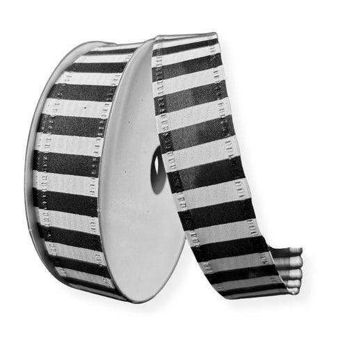 A spool of 7/8" Black & White Striped Satin Ribbon (76466-05-21) is unrolled to the right, with the ribbon hanging loose against a plain white background.
