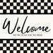 Black and white check Welcome metal sign with We’re Glad You’re Here lettering.