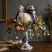 Blue chinoiserie 10 inch metal fall sign with cream pumpkin, blue and white bow, eucalyptus, autumn leaves and floral pedestal, TTE-643.