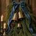 10 x 10 metal Christmas wreath sign featuring antique brass bells, evergreen cedar, pinecones, blue berries, and a blue velvet bow. Exclusive Trendy Tree Design for deco mesh wreaths, grapevine wreaths, or framing. SKU TTE-507.