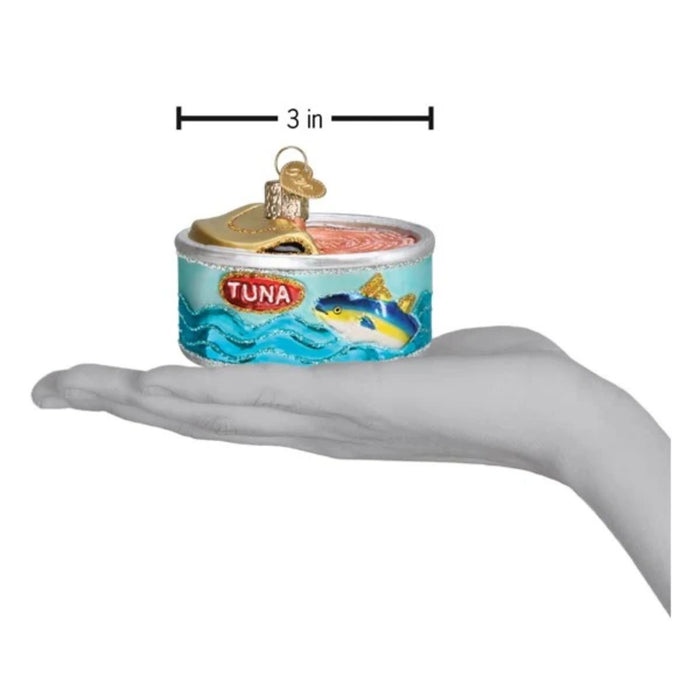 Add protein-packed whimsy to your tree with the Canned Tuna Old World Christmas Ornament 32616—a charming ornament shaped like a tuna can. It features a blue fish and waves on the label, a partially opened lid revealing pink “tuna” inside, and a gold pull tab adorned with a heart charm.