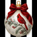Flat metal Christmas sign printed with ivory ornament artwork featuring a red cardinal, snowy pine, berries, pinecones, red bow, and black-and-white stripes