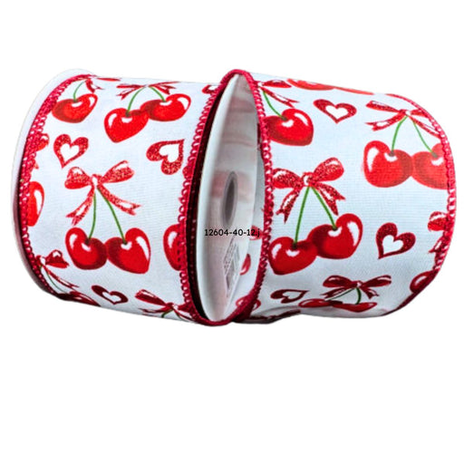 Roll of white satin ribbon with red heart-shaped cherries tied with bows, accented by red hearts and wired red stitched edges; 2.5 inches wide.