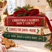 Christmas cookbook stack with funny holiday sayings, red velvet bow, holly and gingerbread cookie