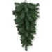 The 24" Green Artificial Pine Christmas Teardrop Swag 82298-GN features dense, green, needle-like foliage hanging upside down to resemble a cluster of evergreen branches—ideal for wreath making or as festive Christmas door décor.