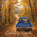 10 inch metal Country Roads fall wreath sign with vintage blue truck on dirt road with autumn trees, wreath accent sign for mesh or grapevine wreath, SKU TTE-425