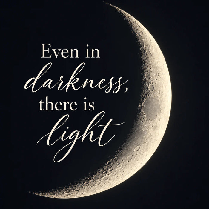 Flat metal inspirational sign featuring the words "Even in darkness, there is light" in elegant cream-colored script and serif lettering beside a large glowing crescent moon. Detailed lunar craters and a deep black night sky create a peaceful, dramatic design. TTE-865.