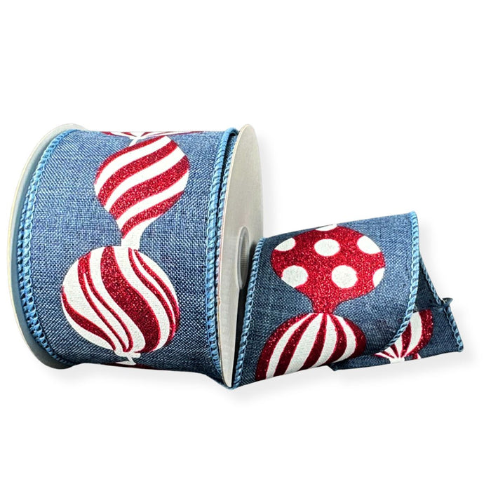 Denim blue linen wired Christmas ribbon with red and white striped, swirled and polka dot ornaments with red glitter accents.