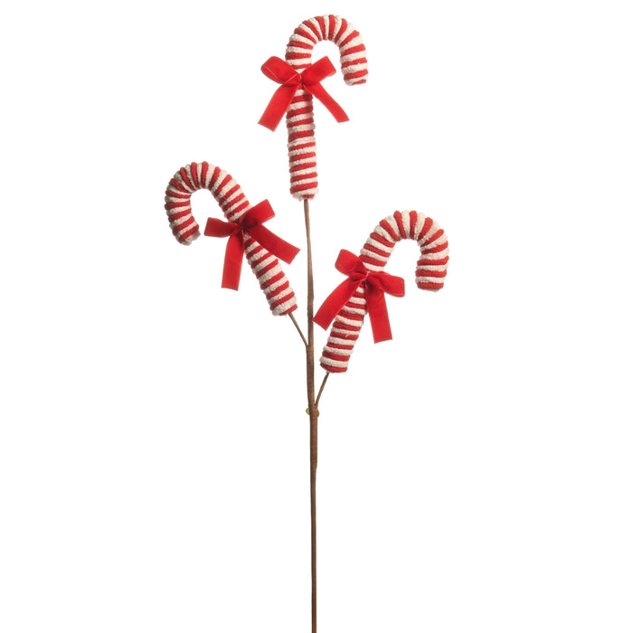 Three red and tan striped peppermint candy canes, each adorned with a red bow and attached to a single brown stem, are arranged at varying heights in the 29″ Red & Tan Peppermint Candy Cane Spray from RAZ Yuletide Traditions (F4606759). This festive spray is perfect for adding a cheerful touch to wreaths or holiday displays.