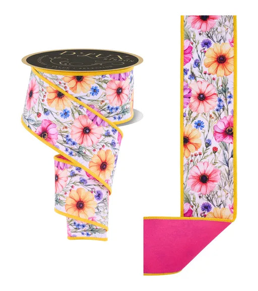 The Whitet Peach Coral Fuchsia Mixed Wildflowers/Fused Ribbon LX1235ET is 2.5" wide by 10 yards, featuring pink, yellow & purple wildflowers, yellow edging, a solid magenta back, and shown partially unrolled to display its vibrant design.