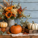 Fall 10 inch metal sign with sunflowers, cream hydrangeas, eucalyptus, orange and cream pumpkins against a soft blue background, TTE-631.